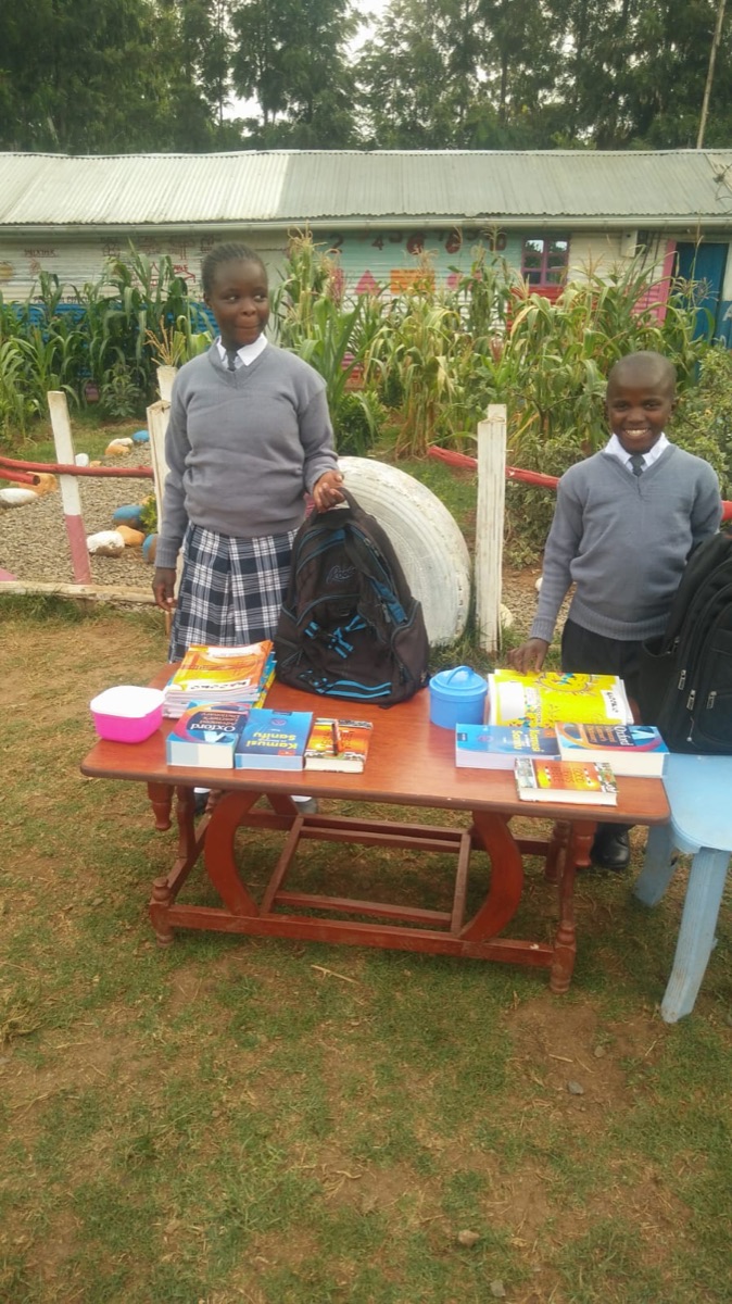 Students with new school bags and books